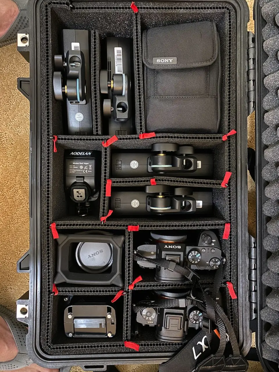 Professional cameras, lenses and accessories organized in a protective travel case for an onsite headshot assignment